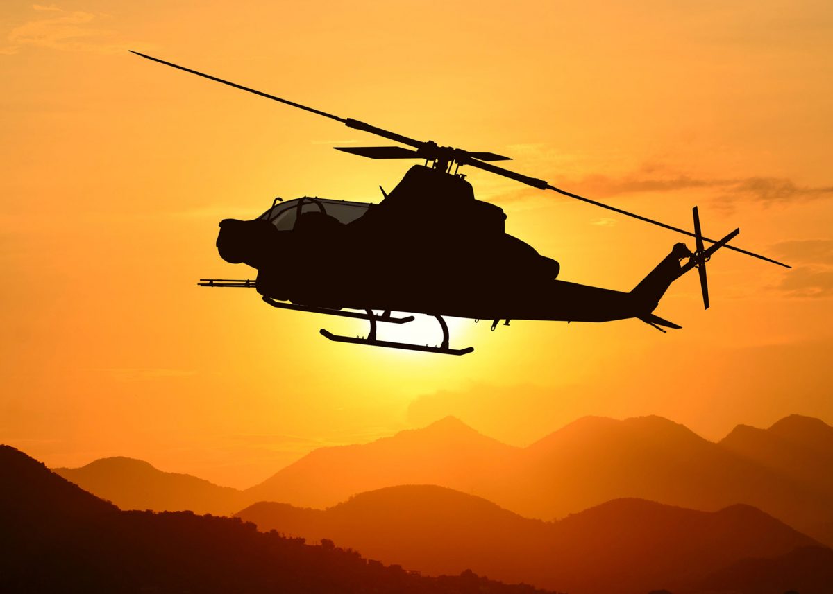 American attack helicopter AH-1Z Viper silhouette in the flight