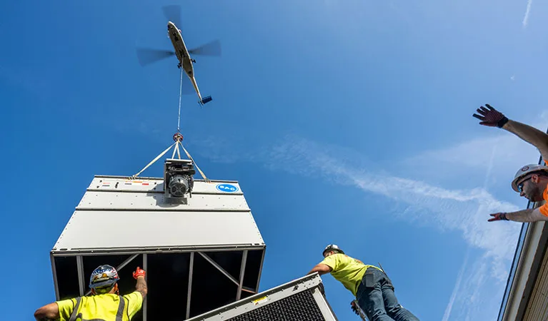 Heavy Lift Helicopter - HVAC RTU Lift in Progress