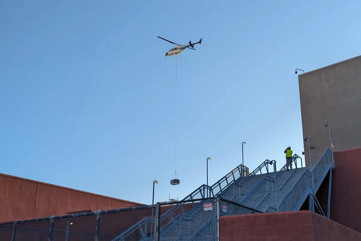 Bell 206 Jet Ranger executing the HVAC installation on the roof of Park Place Mall.