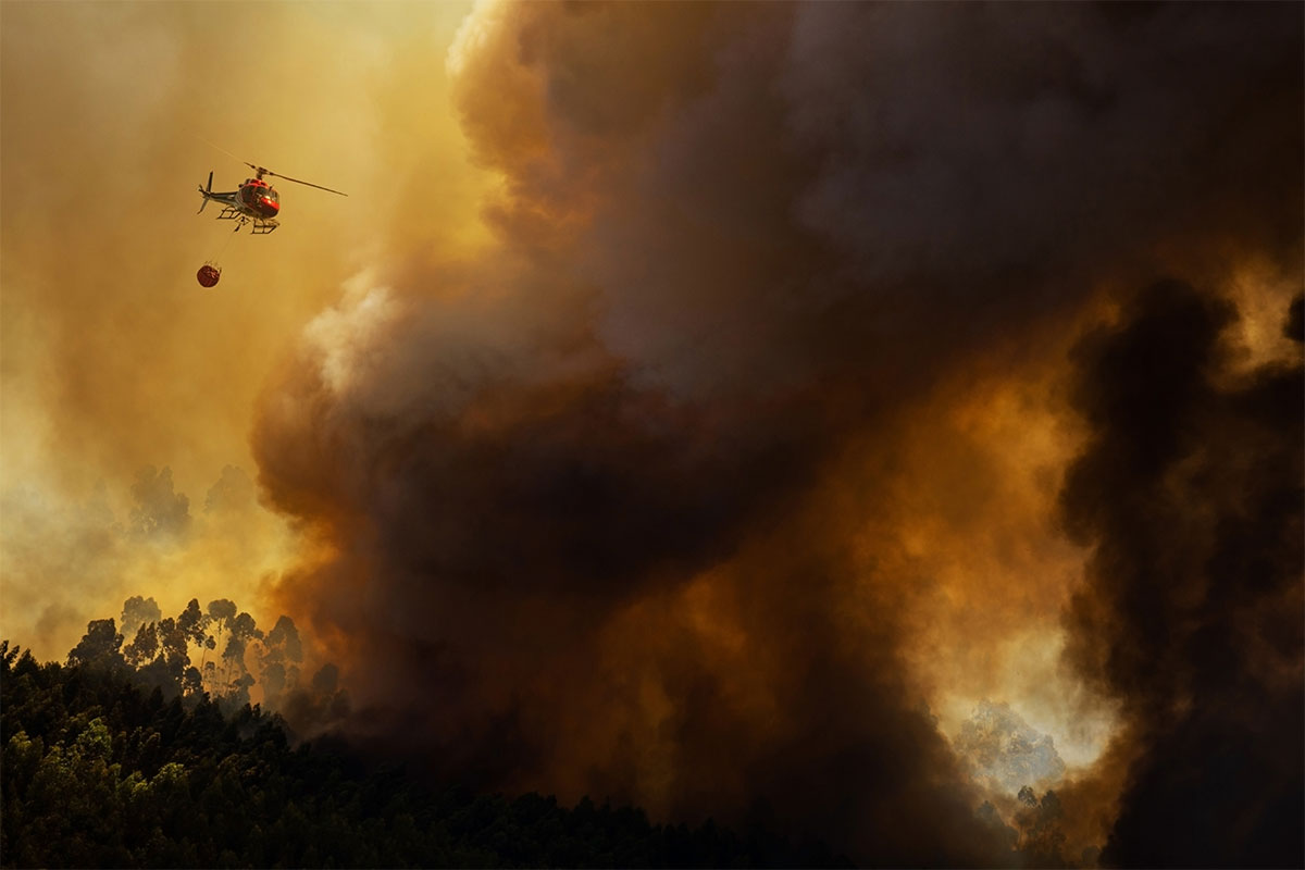 Fire and Rescue Helicopter Fighting Wildfires with Bambi Bucket