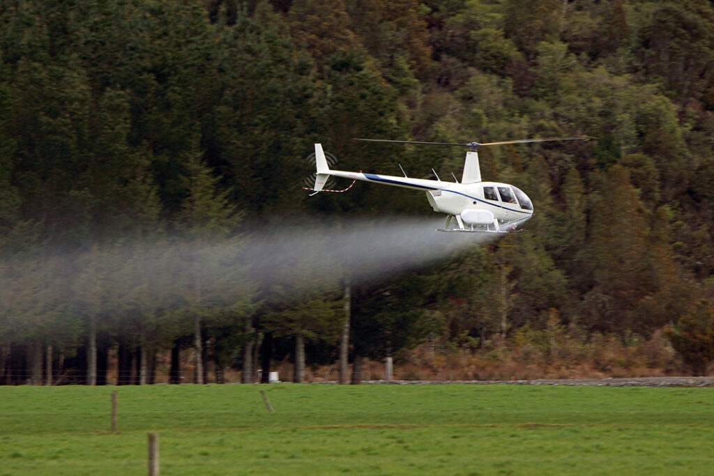 Helicopter spraying pesticide