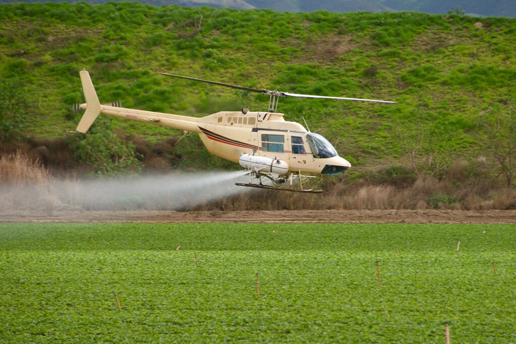Agriculture Helicopter spraying pesticide