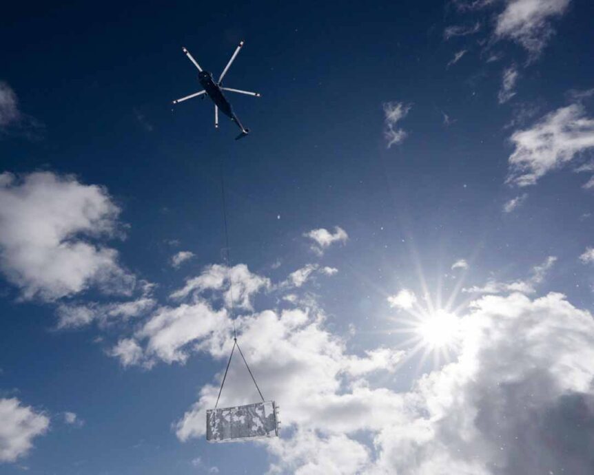 Prefab equipment shelter helicopter lift | Photo: Sappi North America, Inc and Total Leadership Solutions.