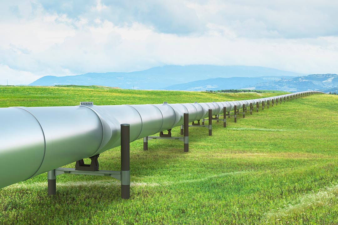 A pipeline spanning a green field