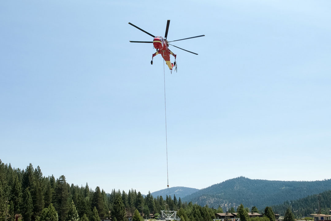 S-64 Skycrane lifting in a remote area