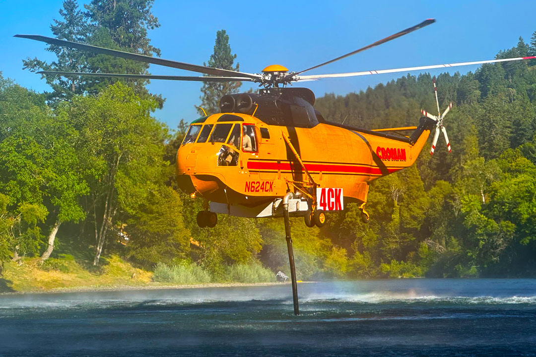 Sikorsky Firefighting Helicopters S-64E and S-61A in Water Tank Refill Operations