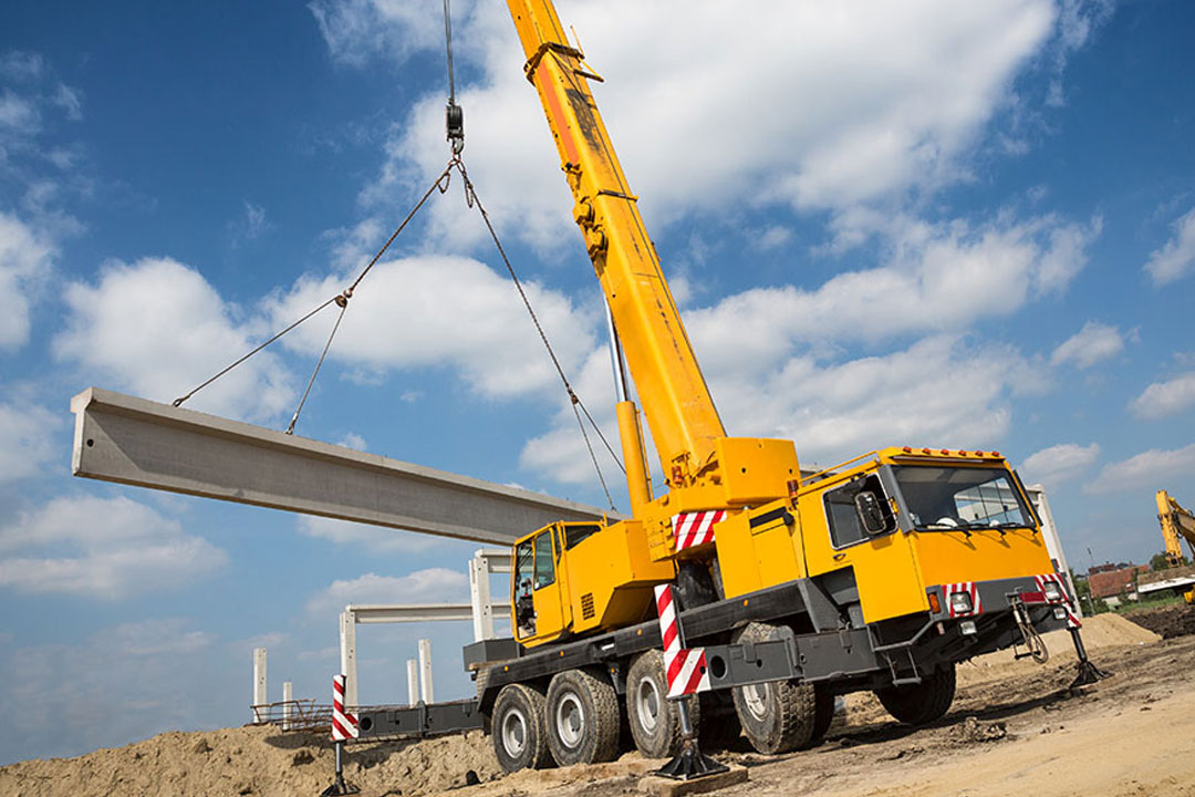 As a crane reaches further across a roof, its lifting capacity drops—which can force you to rent a much larger, more expensive crane class.