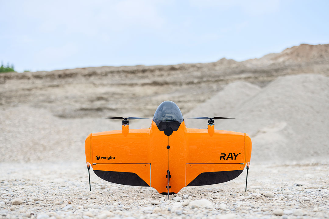 A Wingtra Ray aerial survey drone sits at rest at a job site. | Photo: wingtra.com