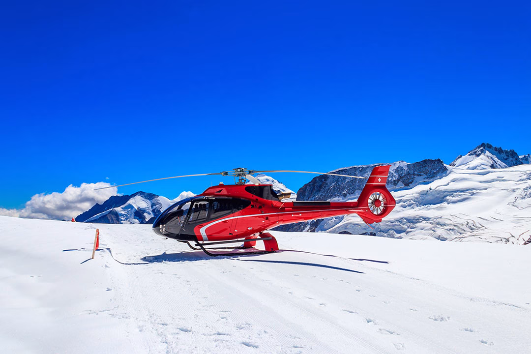 helicopter landed at Jungfrau mountain in Bernese Oberland, Switzerland