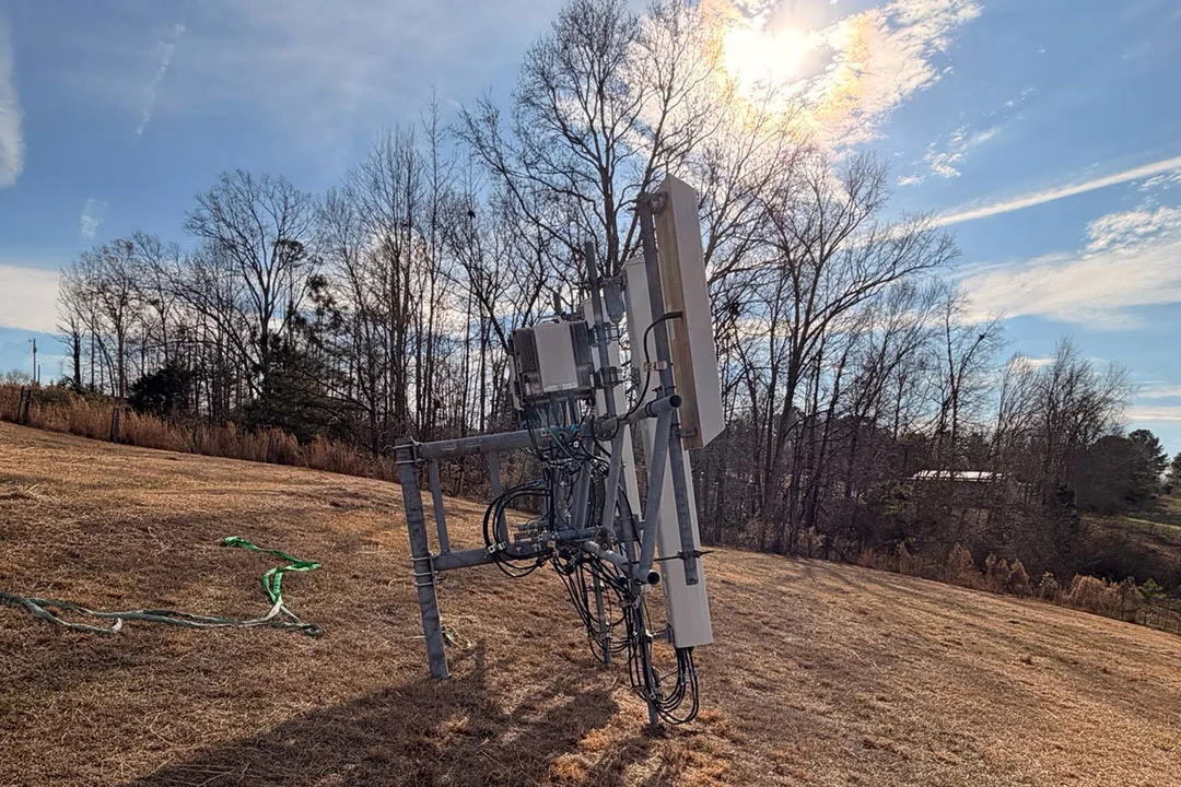 New telecom antenna mounts and radio equipment staged on the ground prior to installation, prepared for helicopter lifting as part of the Next Edge Networks tower upgrade project.