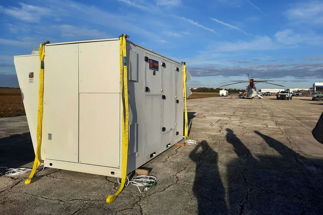 A rooftop commercial HVAC unit awaiting a lift.