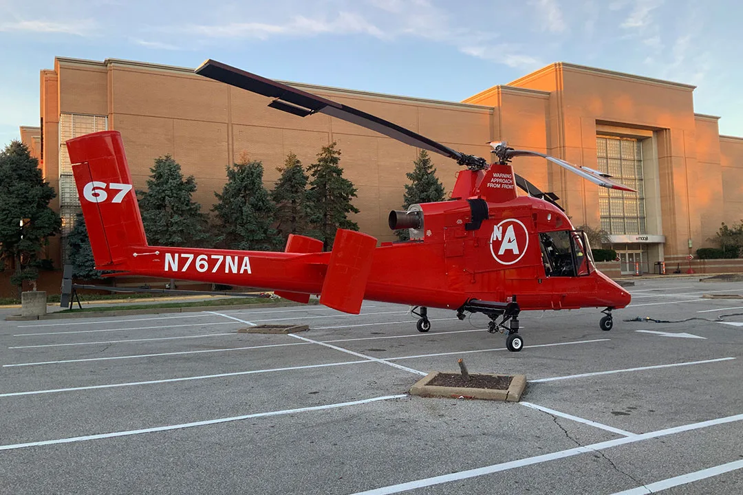 A Kaman K-MAX sits in a staging area for an HVAC lift for Macy's.