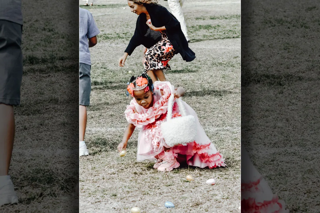 A mother and daughter enjoy the egg drop.