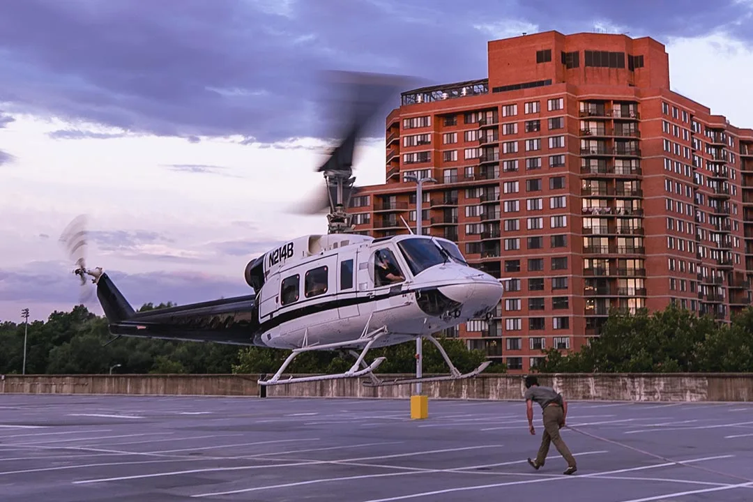 The Bell 214 helicopter hovering over the parking deck staging area. | Photo: Damon Bowe