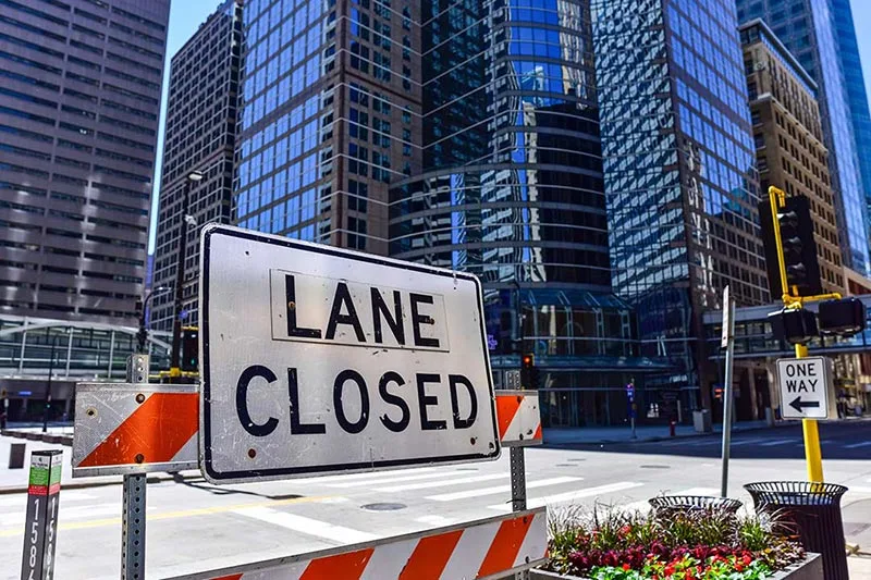 Extended street closures, traffic control, and police details are hidden expenses that can quickly inflate the cost of a crane project.