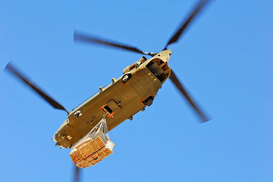 Helicopter transporting oversized cargo by external load