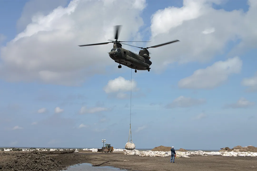 Oversized external load being transported by helicopter